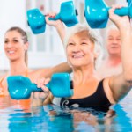 stock-photo-80329795-people-at-water-gymnastics-in-physiotherapy[1]